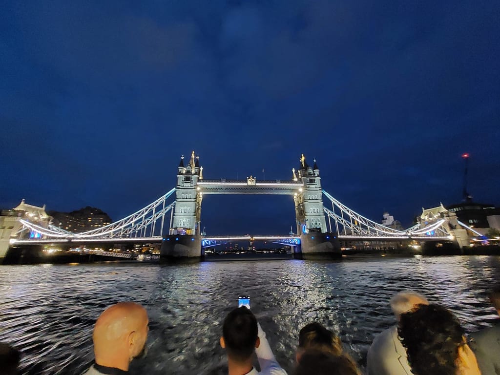 Tower Bridge lit up at night, seen from the boat