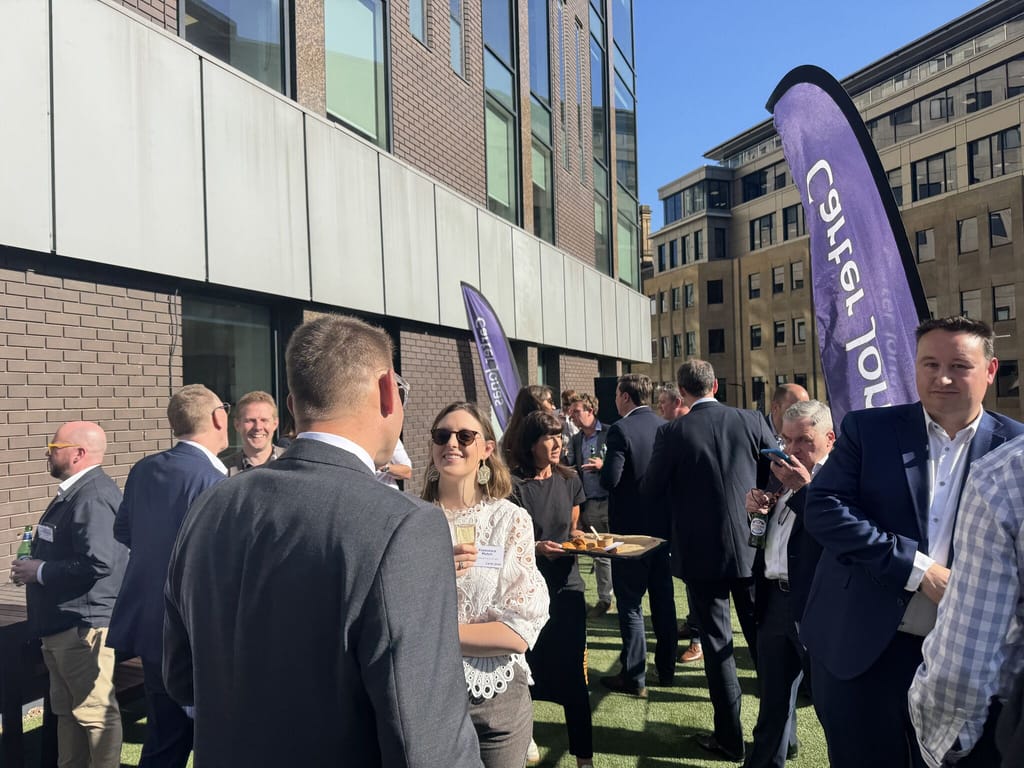 Delegates networking outdoors at a UKREiiF fringe event